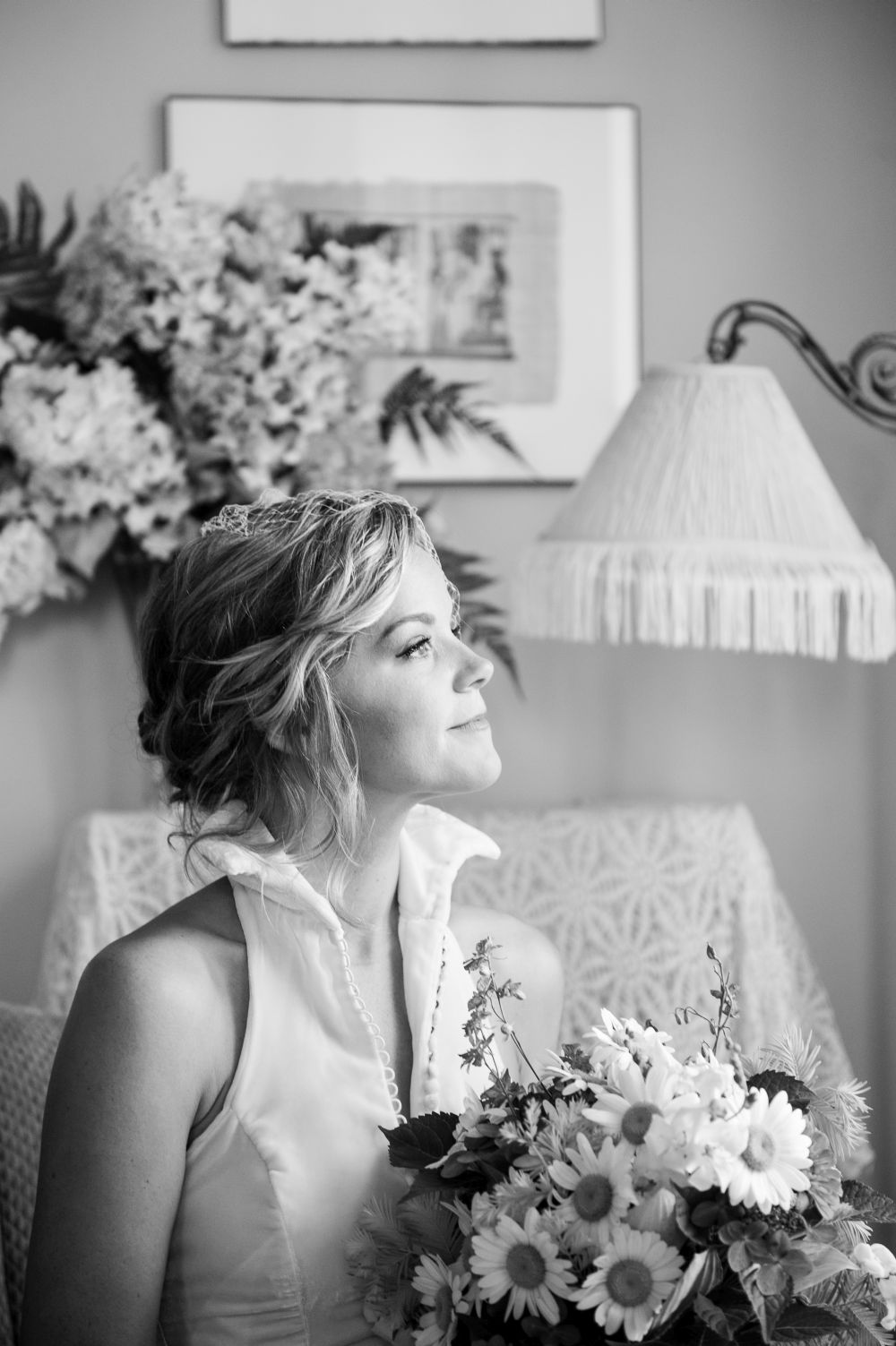 Bride looking out window